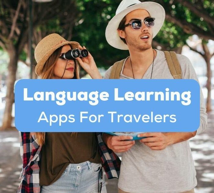 A photo of two tourists behind the Language Learning Apps for Travelers texts.