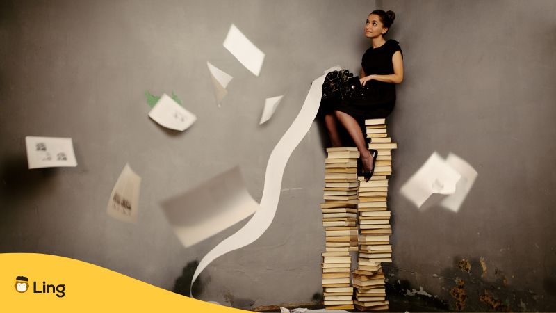 female writer using the typewriter while sitting on top of a pile of  - 12 Popular Korean Female Authors