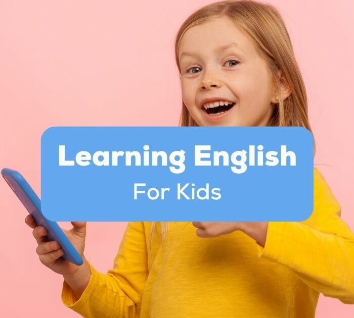 apps for learning English for kids - A photo of a girl enjoys using her mobile phone