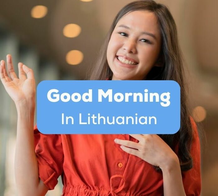 A photo of a pretty smiling girl waving her hands behind the Good Morning In Lithuanian texts.