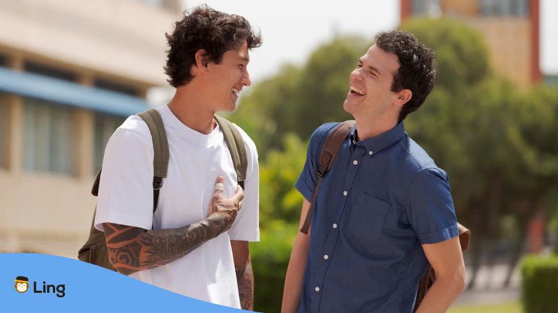 A photo of two male friends looking happy in the morning.