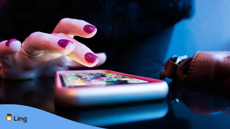 Female hands with a smartphone- Language apps for visual learners