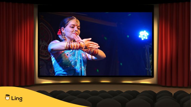 malayalam actress dancing in a scene inside a cinema in india