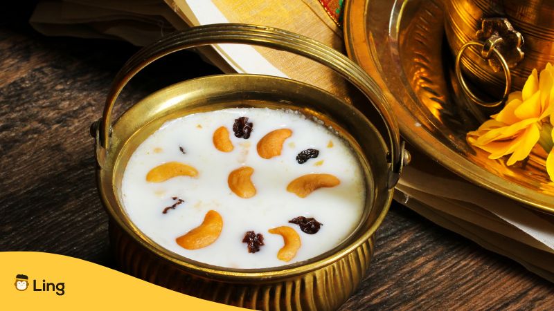 malayalam traditional dessert with raisins, coconut milk, and cashew nuts placed in a gold pot