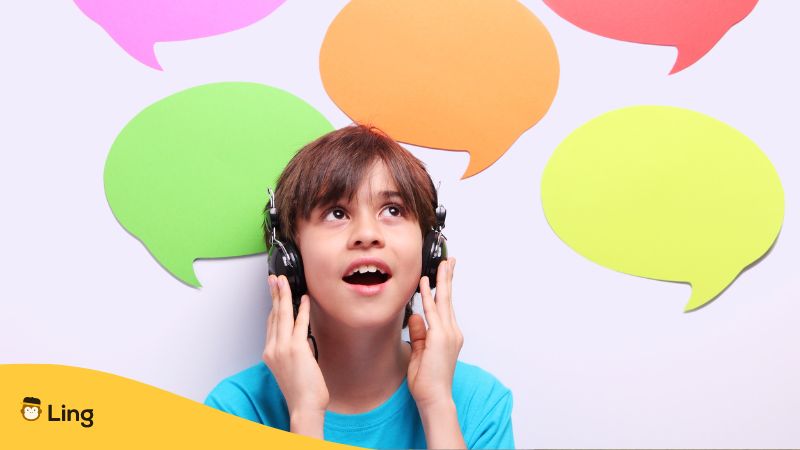 boy listening to headset with cutouts of colorful speech bubbles in the background