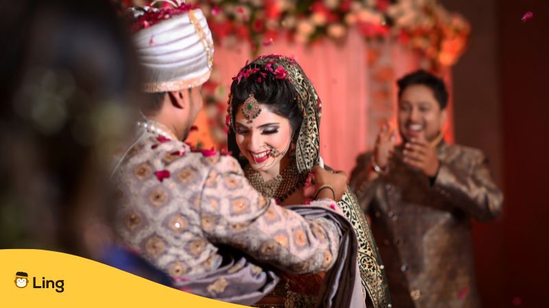 indian marriage with bride and groom dancing