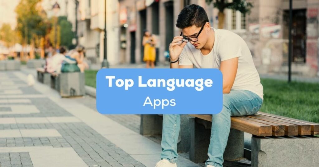A photo of a man sitting on a bench in a park behind the Top Language Apps texts.