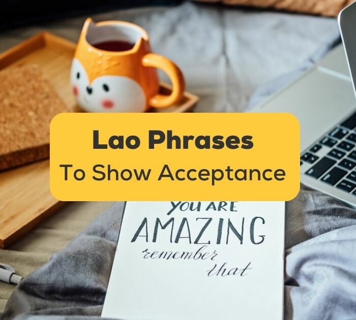 lao phrases to show acceptance banner with mug, laptop, and notebook with you're amazing written