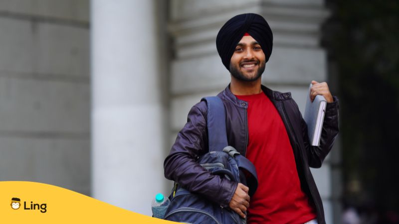 best Punjabi online courses - A photo of a man holding a book and a bag