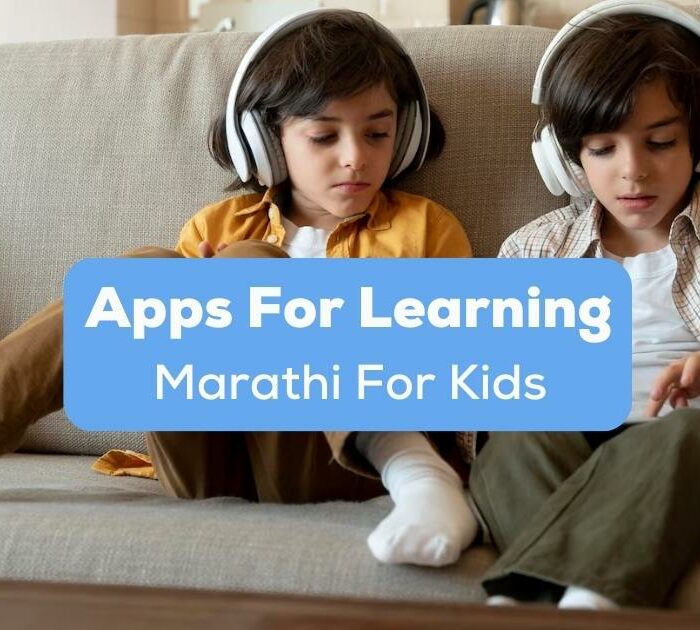 A photo of little twins playing on their tablet while using headphones on a couch behind the Apps For Learning Marathi For Kids texts.