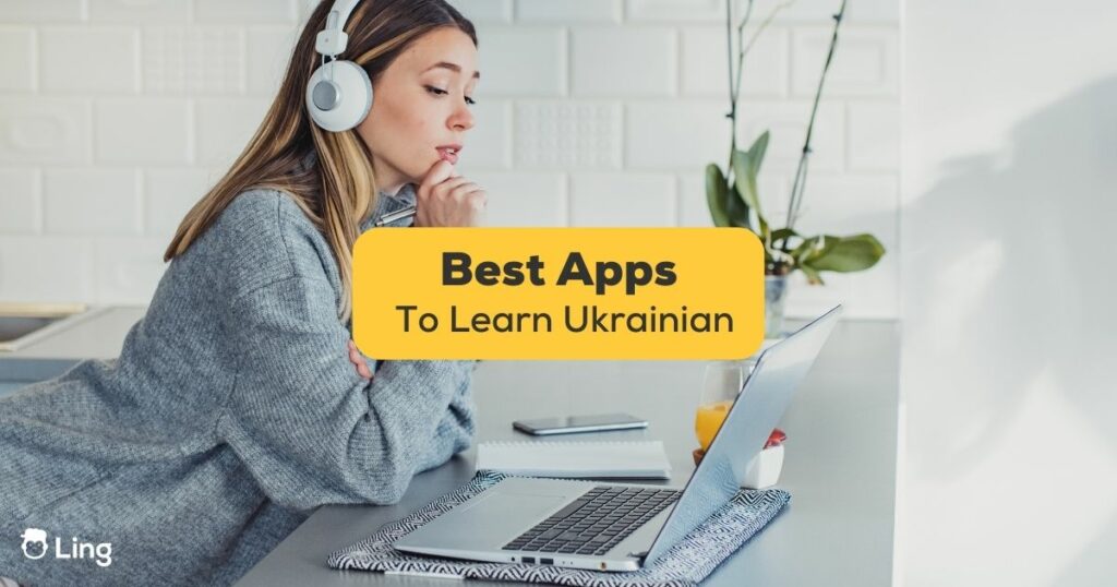 apps to learn Ukrainian - A photo of a woman with headphones using her laptop