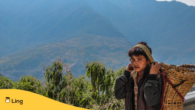 Nepali boy with Nepal scenery in the background