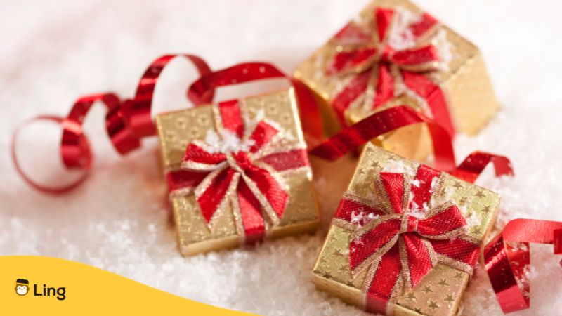 gifts wrapped in gold wrapper and red ribbons