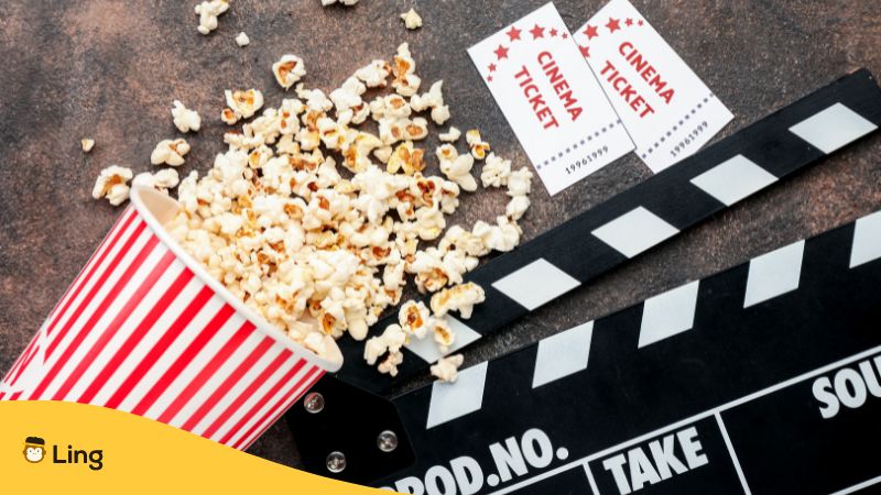 popcorn, clapper, and cinema tickets