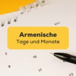 Monatskalender auf gelben Hintergrund mit schwarzem Kuli auf Kalender. Lerne armenische Tage und Monate mit der Ling-App.