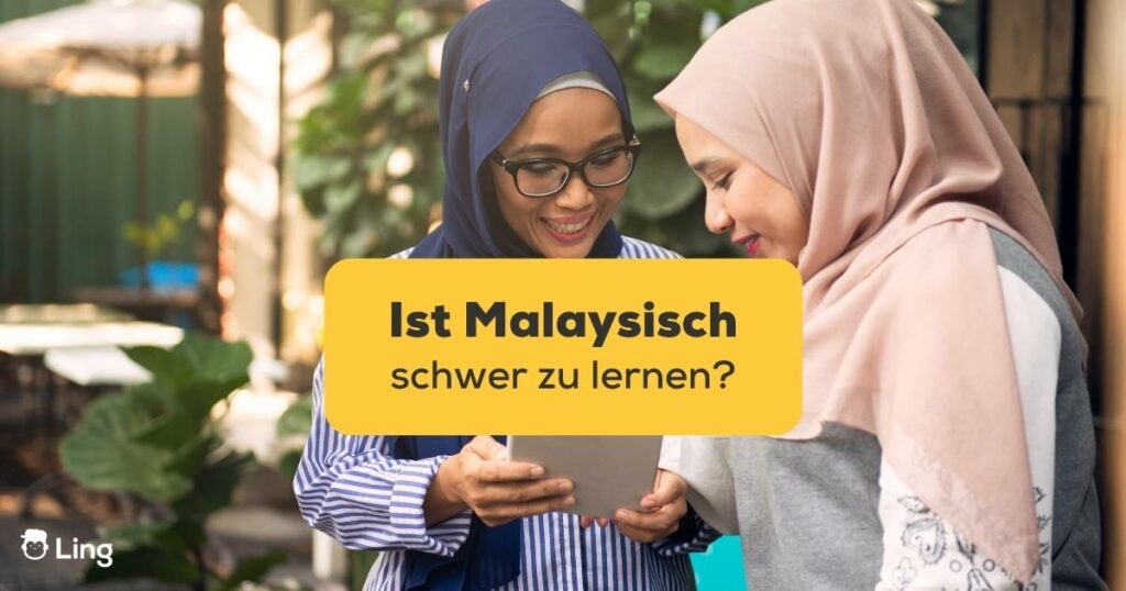Zwei junge Malaysische Frauen mit Kopftuch diskutieren, ist Malaysisch schwer zu lernen?