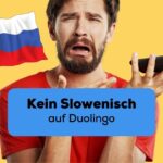 Brünetter Man hält Handy frustrierend in der Hand und regt sich darüber auf, dass es Kein Slowenisch auf Duolingo gibt, aber mit der Ling-App kann er zum Glück trotzdem Slowenisch lernen