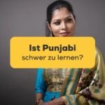 Junge indische Frau in traditionellem Punjabi-Kleidung. Frau schaut nachdenklich auf die Frage, ist Punjabi schwer zu lernen?