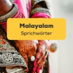 Hand der südindischen Braut mit Armreifen. Lerne Malayalam Sprichwörter und Lerne Malayalam mit der Ling-App.