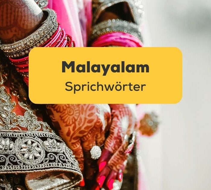 Hand der südindischen Braut mit Armreifen. Lerne Malayalam Sprichwörter und Lerne Malayalam mit der Ling-App.