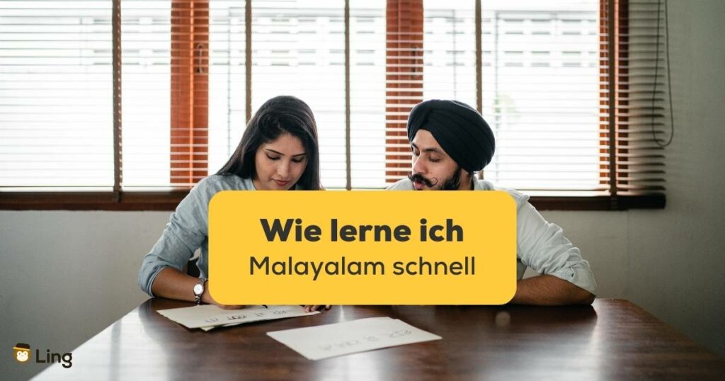 Indische Frau und Mann schreiben Poster am Tisch in einem hellen Büro. Wie lerne ich Malayalam schnell? Erfahre mit der Ling-App 10 Tipps, um schnell Malayalam zu lernen!