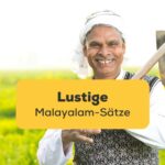 Indischer Bauer hält Hacke und lächelt erfreut. Lerne lustige Malayalam-Sätze mit der Ling-App.