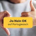 Eine Frau macht Daumen hoch und Daumen runter Handzeichen. Lerne die 3 einfachsten Wörter, die du lernen solltest, Ja Nein Ok auf Portugiesisch mit der Ling-App.
