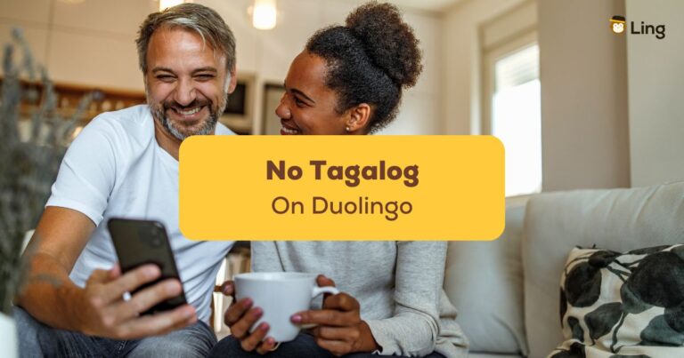 A Man And A Woman Are Looking For Language Learning Apps On Their Mobile Phone Since There Is No Tagalog On Duolingo