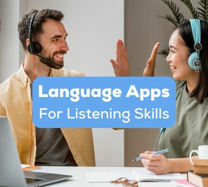 language apps for listening skills - A photo of two happy language learners with headphones.