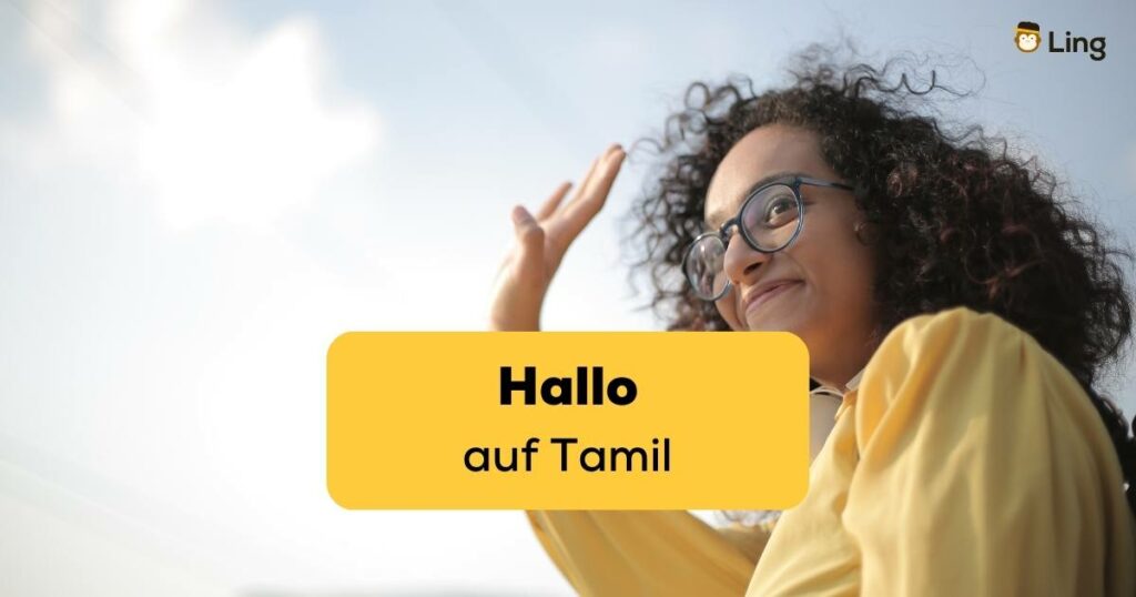 Frau hebt Hand um Hallo auf Tamil zu sagen, was sie dank der Ling-App gelernt hat