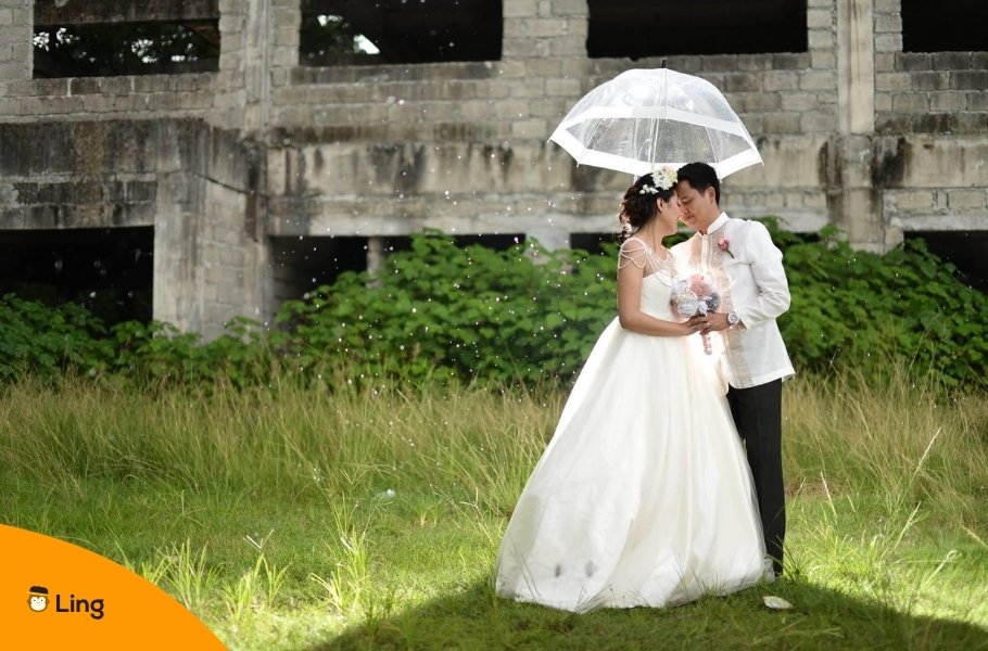 Newlywed Filipino Couple With Umbrella Outdoors
