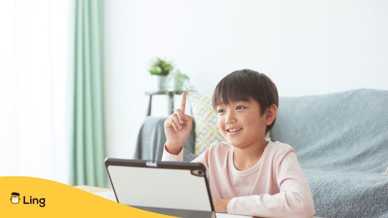A Young Boy Is Taking His Online Language Class