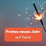 Hand hält eine Zündkerze vor bläulich, roten Hintergrund. Die 100 besten Möglichkeiten ein Frohes neues Jahr auf Tamil zu sagen.