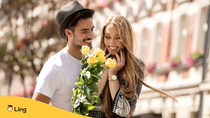 A couple with yellow roses for Slovenian Dating Words