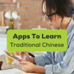 Apps to learn Traditional Chinese - A photo of a woman using phone learning Chinese.