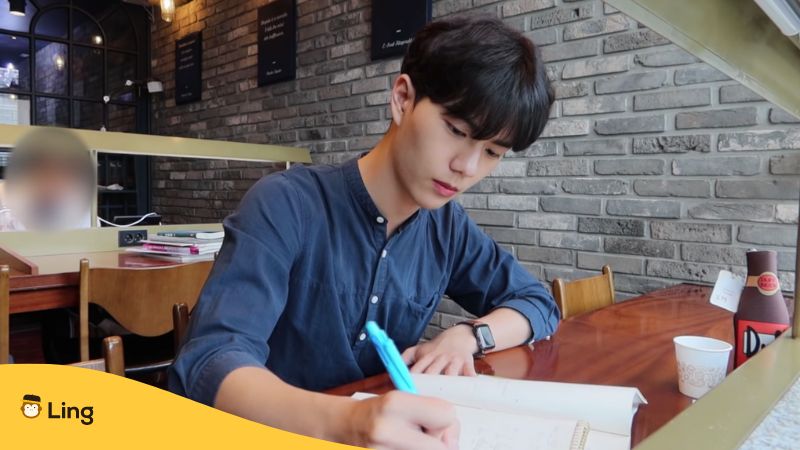 An image of a Korean guy studying Korean