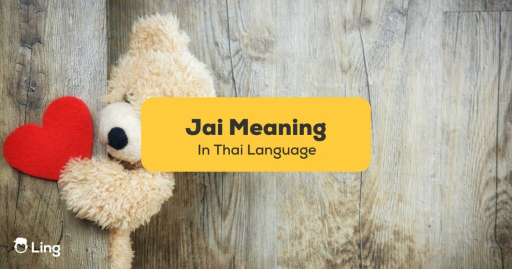 a teddy bear holding a red heart jai meaning in Thai
