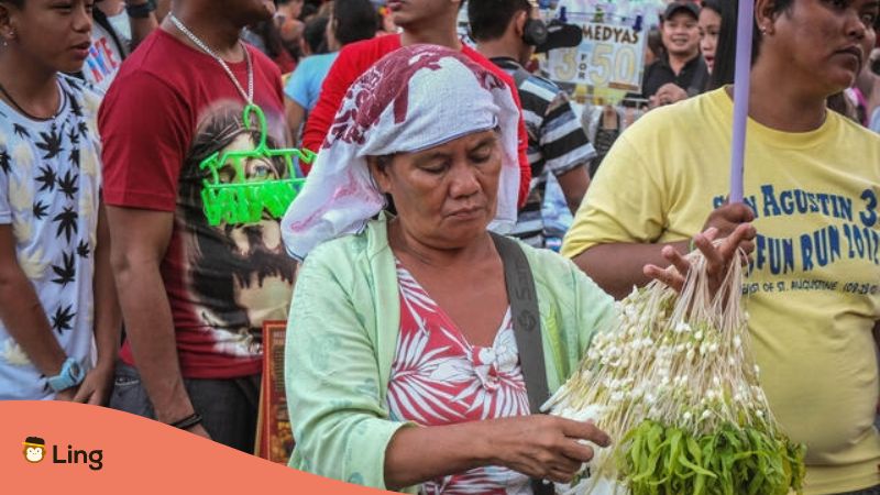 national flower of the Philippines - a photo of a Sampaguita vendor