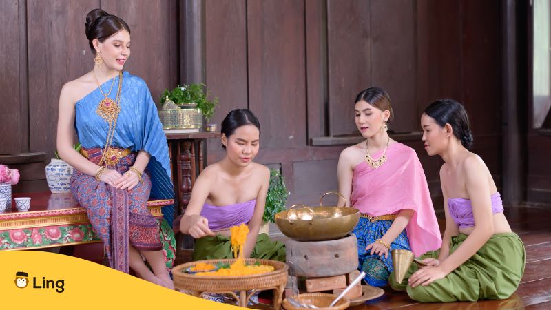 An image of four Thai ladies using poetic Thai words while cooking
