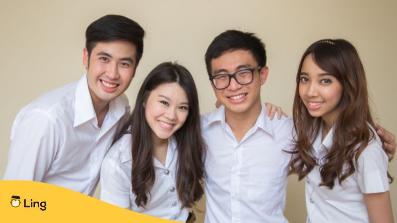 Four young people smiling at the camera - Thai vs Chinese - Ling app 