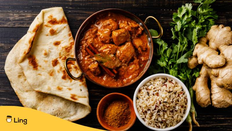 Chicken Tikka Masala würziges Curry-Fleischgericht mit Reis und Naan-Brot. Lerne Vokabeln über Essen auf Nepali mit Ling!
