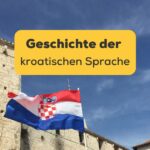 Kroatische Flagge weht im Wind. Entdecke die Geschichte der kroatischen Sprache und ihre 5 beeindruckenden Epochen!