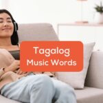 Tagalog music words - A photo of a woman on a couch listening to songs.