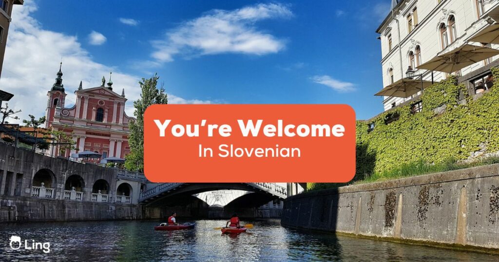 You Are Welcome In Slovenian - River with a bridge in a city, with a church on the left