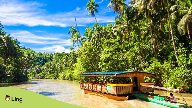 Geography in Filipino - A photo of a tourist boat on a river.