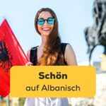 Junge schöne Albanerin mit der albanischen Flagge. Entdecke über 5 Möglichkeiten mit Ling, schön auf Albanisch zu sagen.