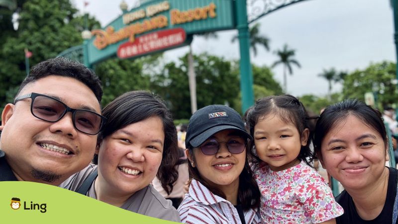 A photo of a family in Disneyland when traveling in Hong Kong.