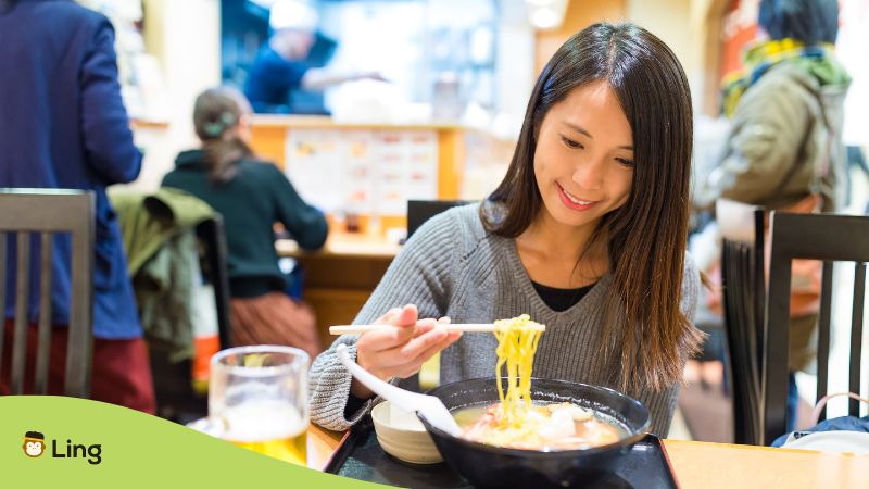 Japanese weird words - A photo of a Japanese girl eating ramen.