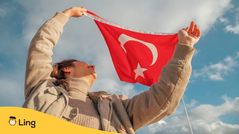 a girl flying Turkish flag-Commemoration of Atatürk-Ling