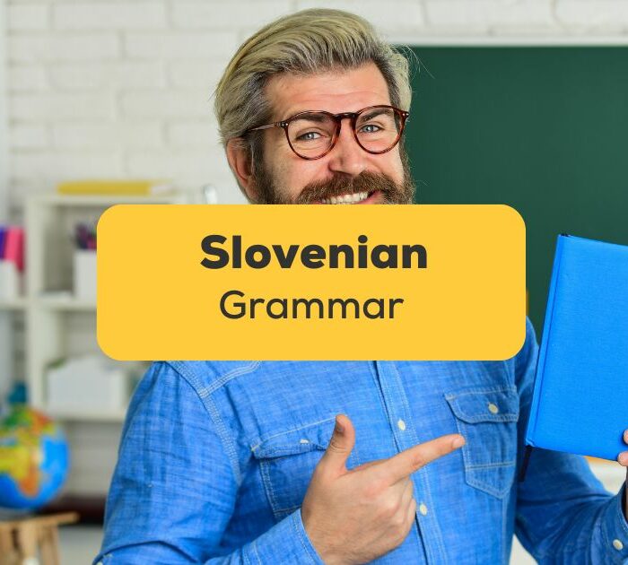 A man with a Slovenian Grammar book